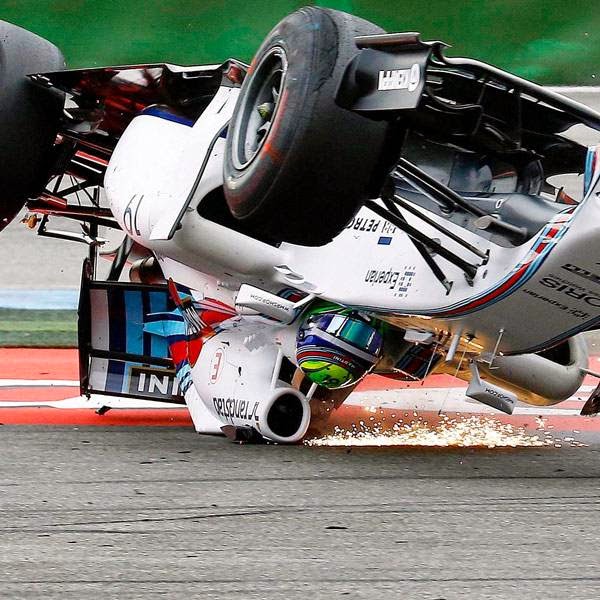 Williams Formula One driver Felipe Massa of Brazil crashes with his car in the first corner after the start of the German F1 Grand Prix at the Hockenheim racing circuit.