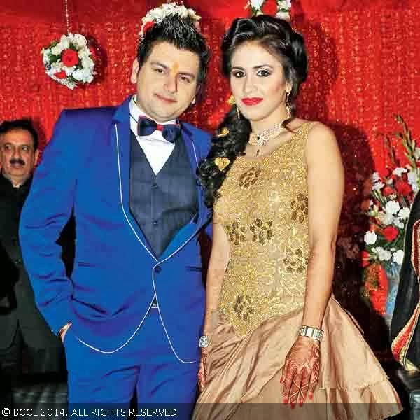 Sahil and Priyanka pose onstage during their engagement ceremony, held in the city.