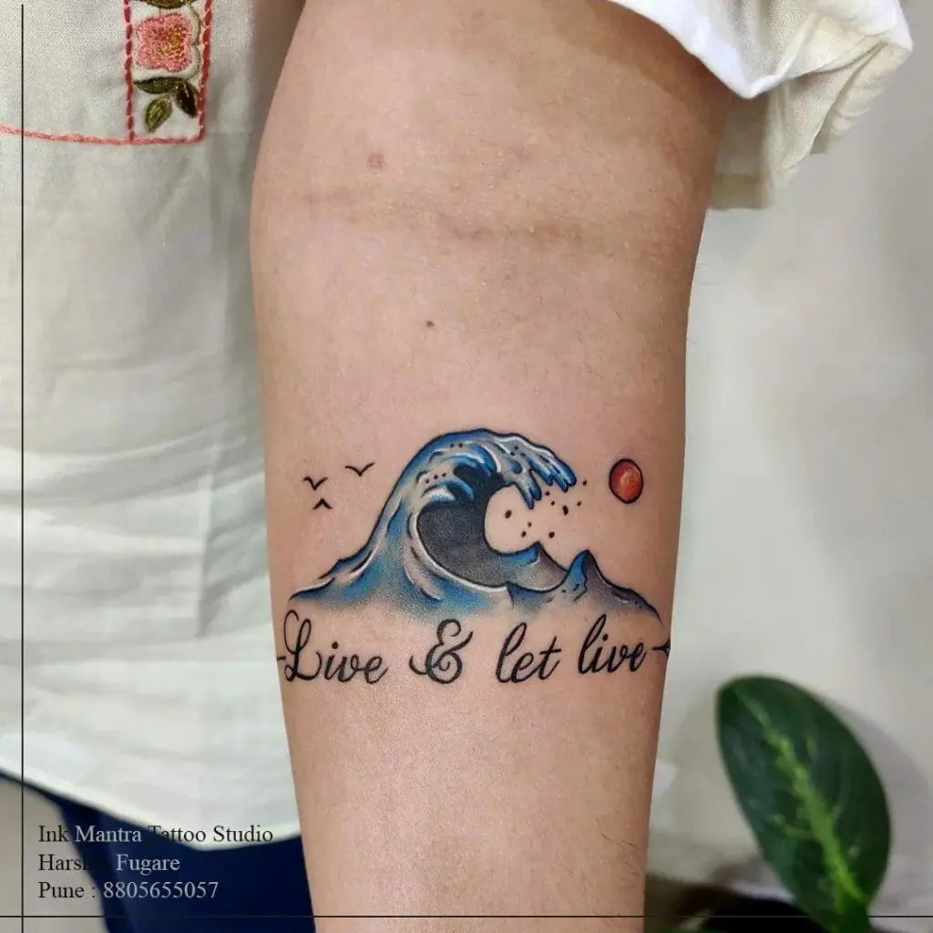 Close up view of the wave and quote tattoo