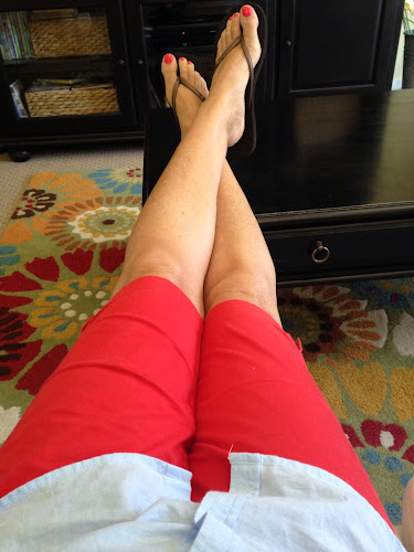 Red knee length shorts, blue button down shirt, fashion Friday