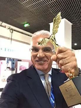 Dr. Calabria with award for surgical facial rejuvenation by the Anti-Aging and Beauty Congress in Paris, France, and the World Plastic Surgery Congress in Monaco