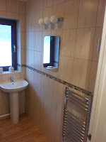 Tiling, radiator, basin and mirror to bathroom