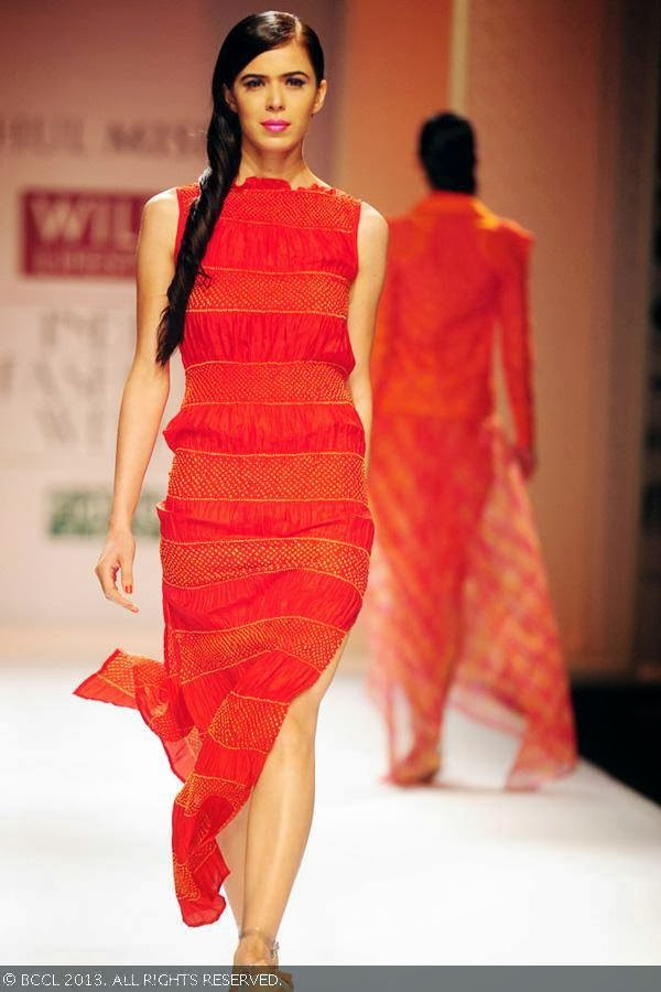 Sucheta Sharma walks the ramp for fashion designer Rahul Mishra on Day 2 of the Wills Lifestyle India Fashion Week (WIFW) Spring/Summer 2014, held in Delhi.