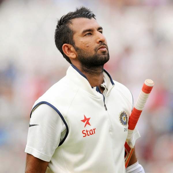 India's Cheteshwar Pujara walks back to the pavilion after being bowled by England's Liam Plunkett caught Ben Stokes for 55 runs during day four of the first Test between England and India at Trent Bridge cricket ground, Nottingham, England, Saturday, July 12, 2014.