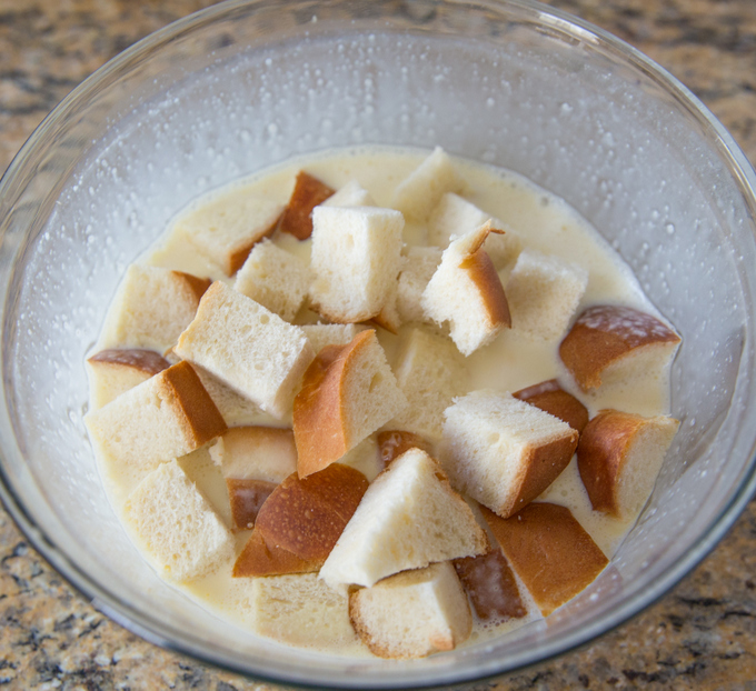 photo of the bread cubes in a bowl with the french toast batter