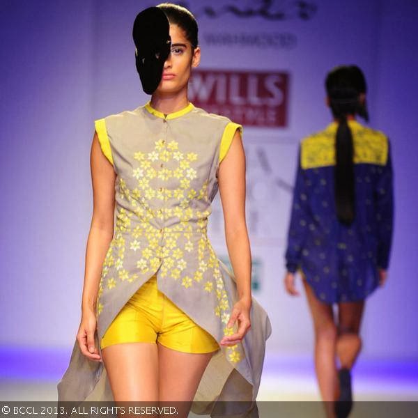 Erika Packard showcases a creation by fashion designer Nida Mahmood on Day 1 of the Wills Lifestyle India Fashion Week (WIFW) Spring/Summer 2014, held in Delhi.