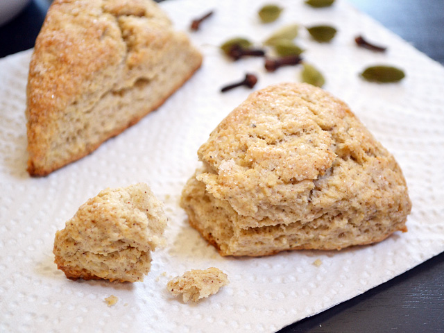 Two Chai Spiced Scones with a piece broken off 