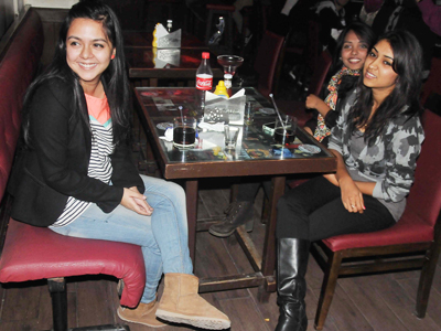 Aradhna (L), Rebecca and Isha at a comedy gig at Cafe Morrison, New Delhi.