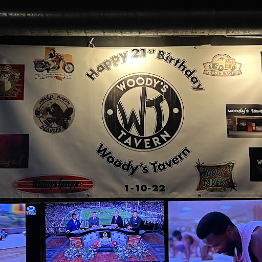 Woody's Tavern logo
