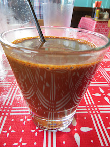 Kafae Boraan, Sook brewed ancient Thai coffee with condensed milk and sugar. Available hot or iced.  It looks thick like an espresso, but it is sweetened up with that condensed milk and sugar, don't worry! This is also good with the Patanko and sankhaya.