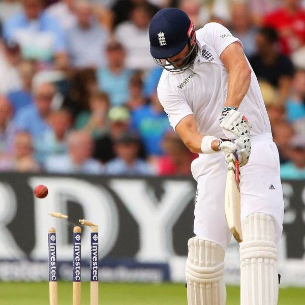 England's Liam Plunkett is bowled out during the third days play in the first cricket Test match between England and India at Trent Bridge in Nottingham, central England on July 11, 2014.