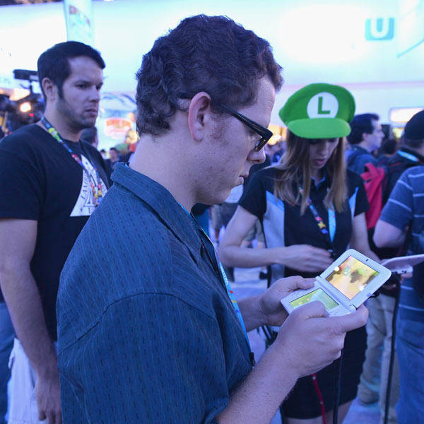 A fan tries out a Nintendo DS at the E3 Gaming and Technology Conference at the Los Angeles Convention Center on June 11, 2013.