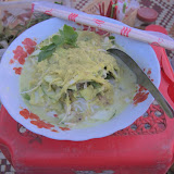 Nom banchok (rice noodles with banana stem, morning glory and other herbs) with yellow fish curry on National Road 6, Siem Reap