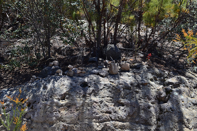 small rocks stacked in many piles