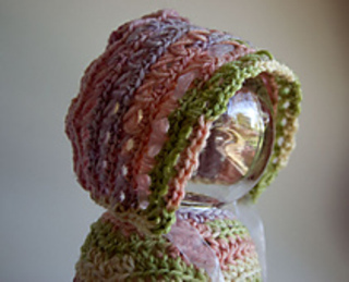 colorful baby bonnet on glass ball