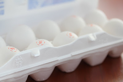photo of an egg carton with eggs