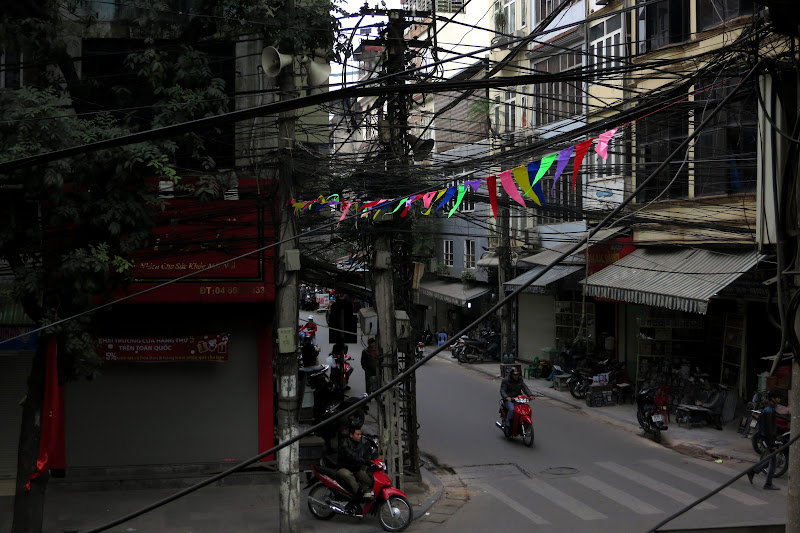 Colorful flags strung across Nguyen Huu Huan Street, Old Quarter
