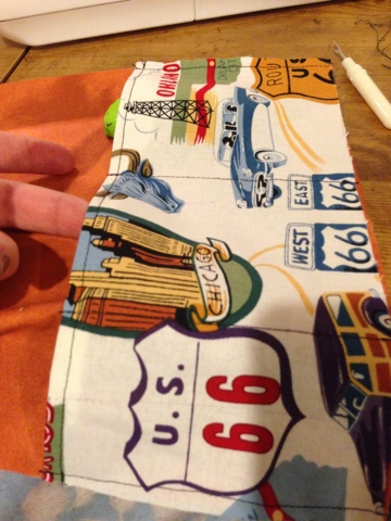 Divide the pocket into several smaller pockets, each sized to fit your toy cars.