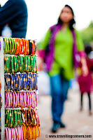 Dilli Haat - A happening place in Capital City of India (Delhi) : Also popular for handicrafts of various Indian States !!! : Posted by VJ SHARMA on www.travellingcamera.com : Dilli Haat is a nice place to hang out in Delhi... Its a place having various options of food and craft items. It's  near to the All India Institute of Medical Sciences on Sri Aurobindo Marg, just opposite to INA Market on Sri Aurobindo Marg... There is another Dilli Haat at Netaji Subash Place which is near to Netaji Subash Place Metro Station. Dilli Haat has stalls representing each state of India which gives a complete variety of tastes available all over India. Check out some of the photographs from Dilli Haat near to INA Market !!! Lady moving towards a shop to buy some colorful bangles from Dilli Haat !!!Of course, this place is very popular among girls as there are lot of options for shopping... Be it colorful or glittering jewelery, ethnic dresses, some art-works to decorate houses etc.. This places has lot of options for shopping colorful stuff from various parts of India !!!  An Art-piece made up of Bamboo roots !!!Dilli Haat is great place to have some creative art pieces which are developed in various parts of India !!! There are some specific shops which belongs to various states of India like Jammu and Kashmir, Himachal Pradesh, Madhya Pradesh, Bihar, Andhra Pradesh etc... Stuff like Madhubani Paintings, Kullu Shwals, Pashmina Shwals from Kashmir etc...There are also stalls of crafts from a variety of cultural traditions of India. Dilli Haat, full of delhites and tourists !!!Although I don't have any photograph of eating joints there but its a good place to find out nice eatables.. One of my friend took me to a shop which is popular for fruit beer and my person experience was not that good :) But it's worth trying !!!As of now there are two Dilli Haats in Delhi and there are plans to open few more... Unlike the traditional weekly market, the village Haat, Dilli Haat is permanent !!! Some shops are permanent but other sellers are rotated usually for fifteen days.It was raining during my recent visit to Dilli Haat which is near to INA market.. As you can see the shops in background have temporary roofs, so it becomes difficult to manage during rains... Although most of the part of these shops are well maintained but they need extra care during monsoons...Key-chains !!! These keychains are made up of leather 'juttis/jootis' :)  My friend bought few of them for gifting them to his friends in Germany !! Lot of colorful stuff for home decoration @ Dilli Haat, Delhi, INDIA Lot of families also come to Dilli Haat during the weekend because children find this place good and they also have lot of options to buy something for their rooms or school !!!Small 'garvas' with coloful/glittering decorations @ Dilli HaatProducts offered may include rosewood and sandalwood carvings, embellished camel hide footwear, sophisticated fabric and drapery, gems, beads, brass-ware, metal crafts, and silk and wool fabrics. Shows promoting handicrafts and handlooms are held at the exhibition hall in the complex. There is a nominal entrance fee to shop at Dilli Haat.. If I remember correctly its 15 Rs and around 5 Rs for children...Girl buying cotton-candy just outside Dilli Haat @ INA, Delhi, INDIA