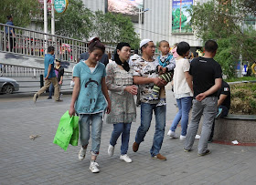 people on sidewalk in Xining, Qinghai, China