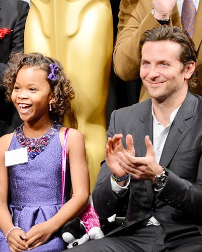 Actress Quvenzhane Wallis (L) and Bradley Cooper enjoying the show during the 85th Academy Awards Nominations Luncheon at The Beverly Hilton Hotel in Beverly Hills, California, on February 4, 2013. <br /> 