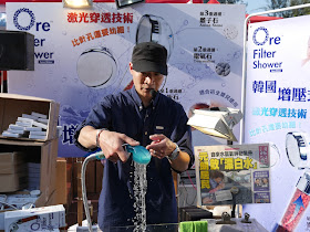 man demonstrating a shower water filter