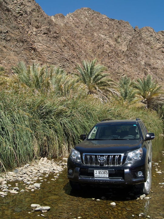 Toyota Prado poses in Wadi Jazira, upstream of the man-made dam and tight gorges.