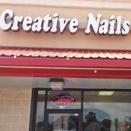 Creative Nails & Spa logo