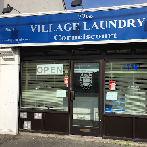 The Village Laundry & Dry Cleaners logo