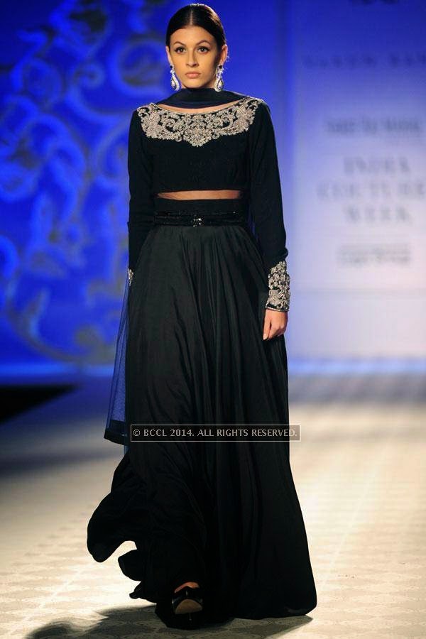 A model walks the ramp for Varun Bahl walks the ramp on Day 3 of India Couture Week, 2014, held at Taj Palace hotel, New Delhi.