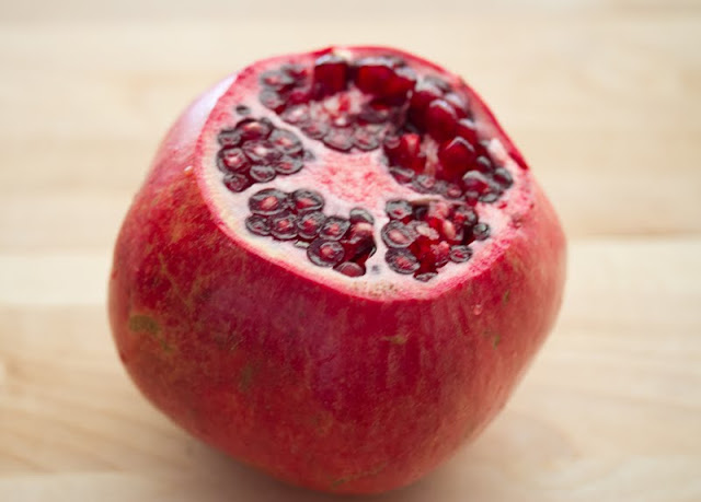 photo of a Pomegranate with the top sliced off