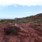 Arrow marker on red cliffs (105430)