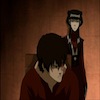 Zuko sitting in a chair; Mai standing behind him.