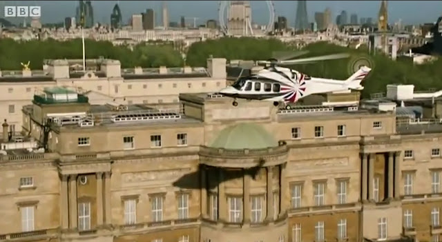 James Bond Escorting The Queen