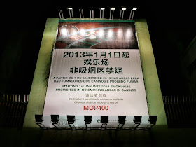 sign reading "Starting 1st January 2013 smoking is prohibited in no smoking areas in Casinos. Offender shall be liable to a fine of MOP400.