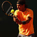 MONTE-CARLO, MONACO - APRIL 21: Rafael Nadal of Spain plays a backhand against Gilles Simon of France in their semi-final during day seven of the ATP Monte Carlo Masters, at Monte-Carlo Sporting Club  on April 21, 2012 in Monte-Carlo, Monaco.  (Photo by Clive Brunskill/Getty Images)
