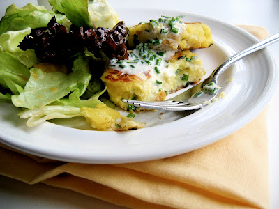 potato cake and salad on a plate 