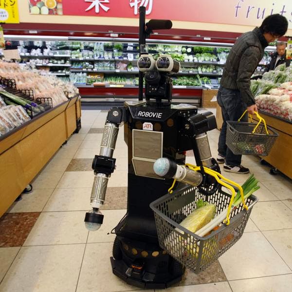 Get this! Japanese robotics research institution ATR developed a robot named "Robovie-II". This robot greets the shopper at the entrance of the store, follows him to the shelves while holding a grocery basket and reminds him of the items on a  shopping list, which the shopper would have entered beforehand in a specialized mobile device.