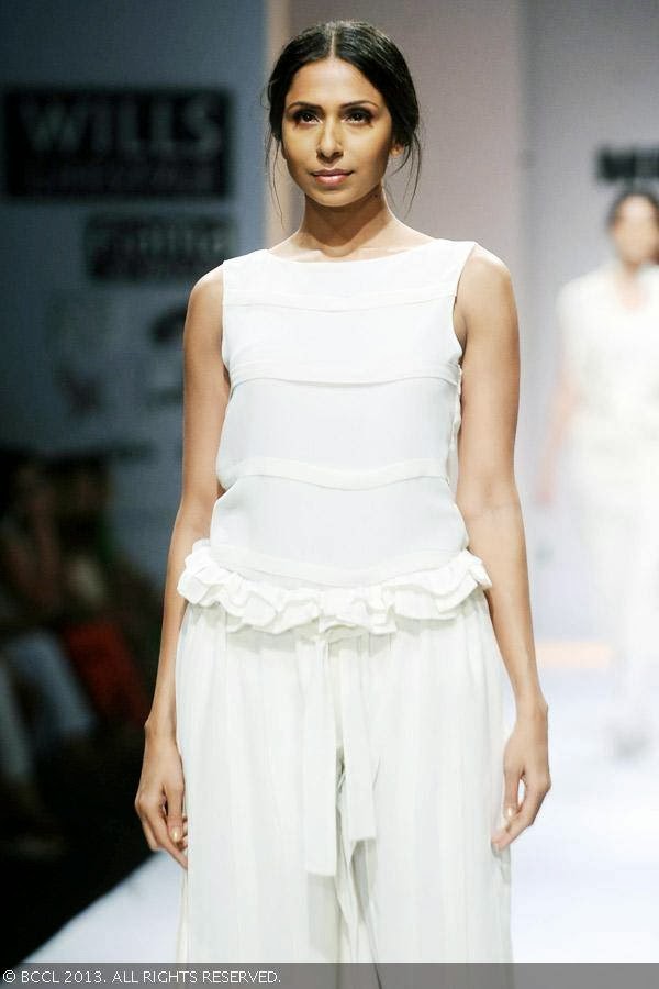 Candice Pinto walks the ramp for fashion designer Mrinalini on Day 3 of the Wills Lifestyle India Fashion Week (WIFW) Spring/Summer 2014, held in Delhi.
