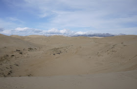 sand dunes and snowcapped mountains near Qinghai Lake