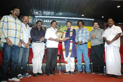 Winners pose onstage during the Saaral Awards 2013, held at Arkay Convention Centre in Chennai.