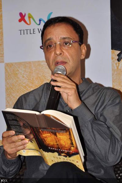 Vidhu Vinod Chopra reads out from author Rahul Pandita's latest book 'Our Moon Has Blood Clots' during its launch, held at Title Waves Book Store in Mumbai on February 4, 2013. (Pic: Viral Bhayani) 