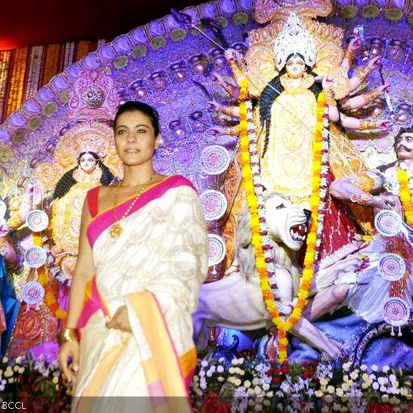 Kajol poses next to the idol during Durga Puja celebrations, held in Mumbai, on October 10, 2013. (Pic: Viral Bhayani)
