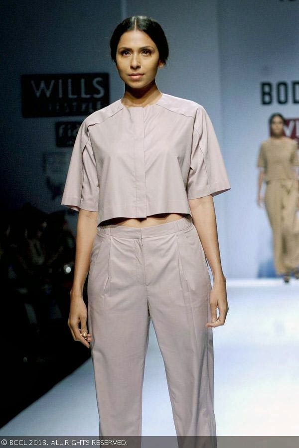 Candice Pinto showcases a creation by fashion designer Ruchika Sachdev on Day 3 of Wills Lifestyle India Fashion Week (WIFW) Spring/Summer 2014, held in Delhi.