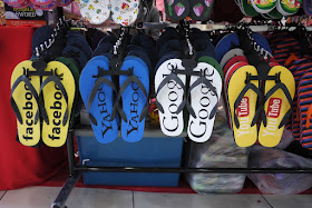 flip-flops with the logos for Facebook, Yahoo, Google, and YouTube