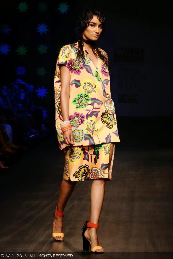 Femina Miss India World 2011 Kanishtha Dhankhar showcases a creation by designer duo Anna Plunkett and Luke Sales on Day 1 of Wills Lifestyle India Fashion Week (WIFW) Spring/Summer 2014, held in Delhi.