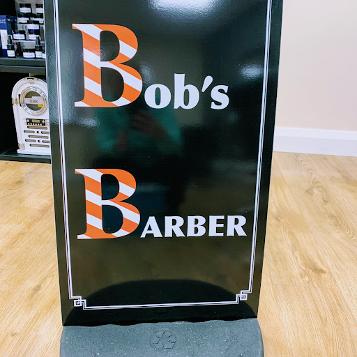 Sharon’s hair and beauty. & Bobs barber. logo