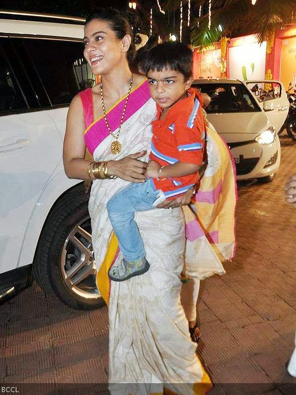 Kajol seen with her cute son Yug during Durga Puja celebrations, held in Mumbai, on October 10, 2013. (Pic: Viral Bhayani) 