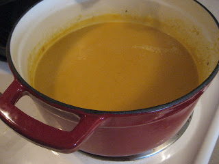 Squash soup in a red pot.