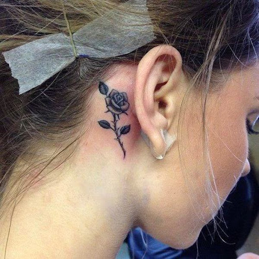 small rose tattoo behind ear